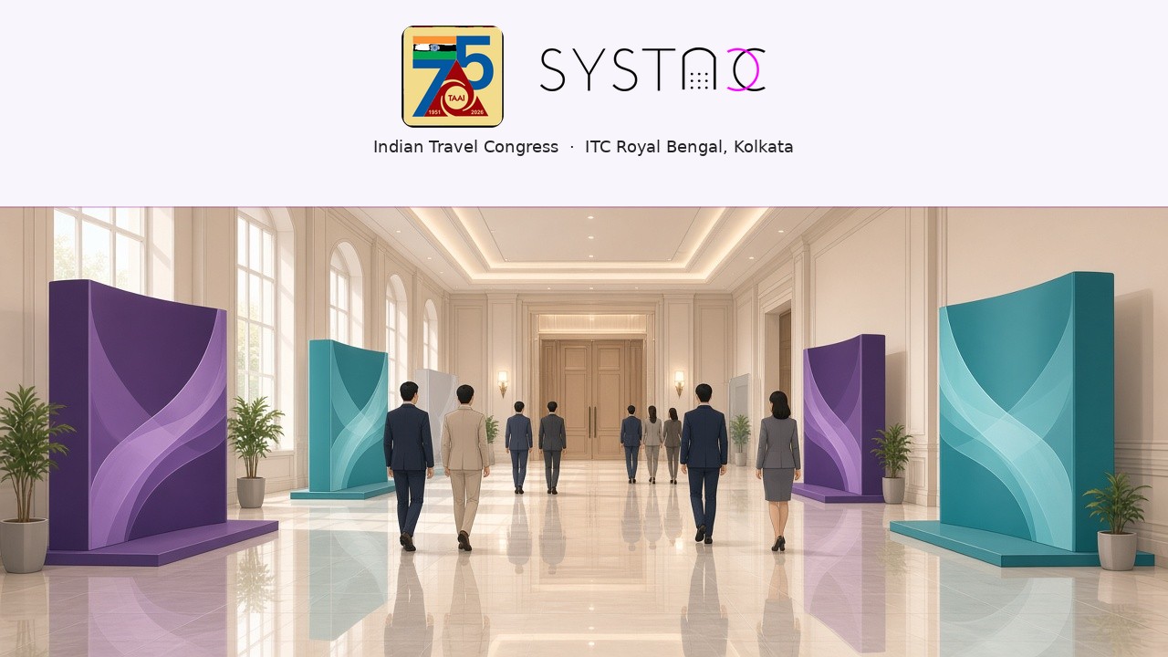 TAAI and SYSTACC logos above a hotel exhibition foyer where delegates walk between stalls toward ballroom doors at the Indian Travel Congress, ITC Royal Bengal, Kolkata.